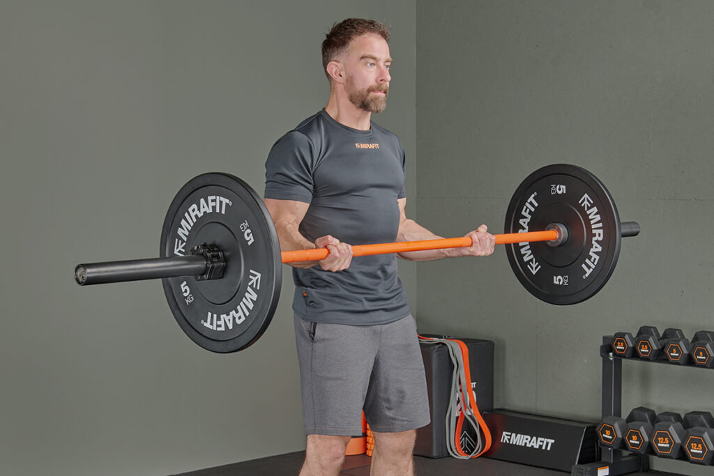 Bicep curl using a Mirafit M3 20kg Olympic Barbell