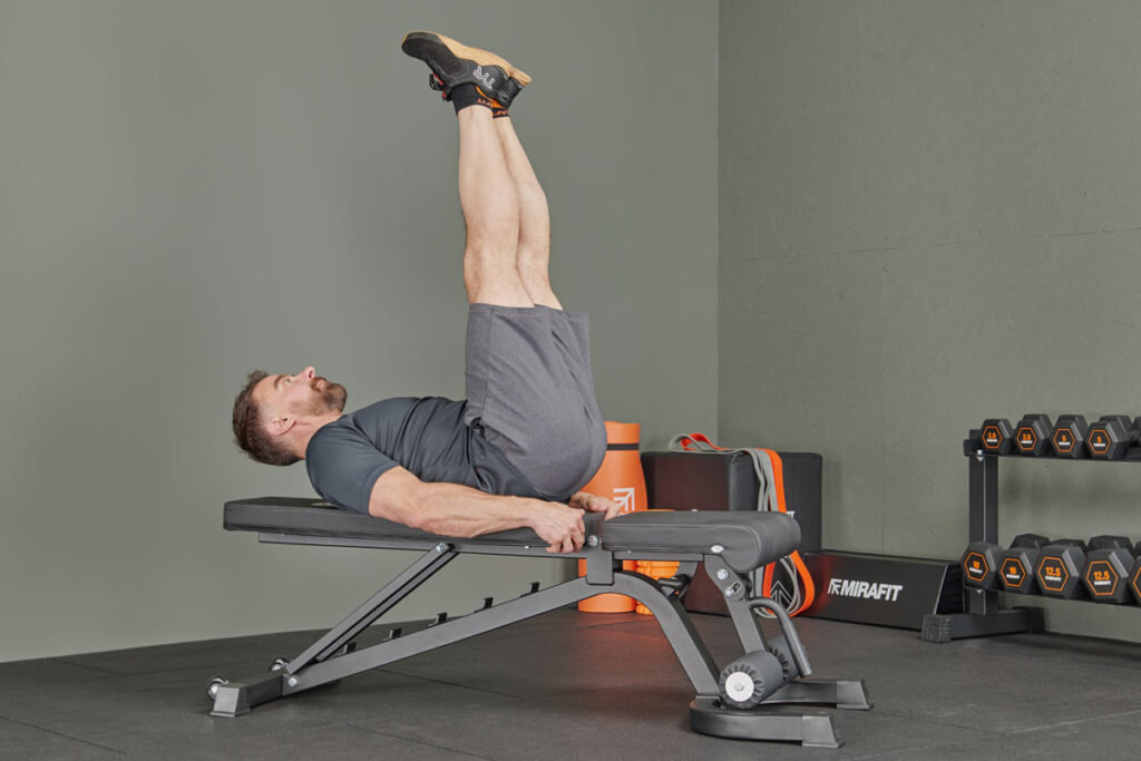 Mirafit M160 FID Adjustable Weight Bench Leg raises on a Mirafit M160 FID Adjustable Weight Bench