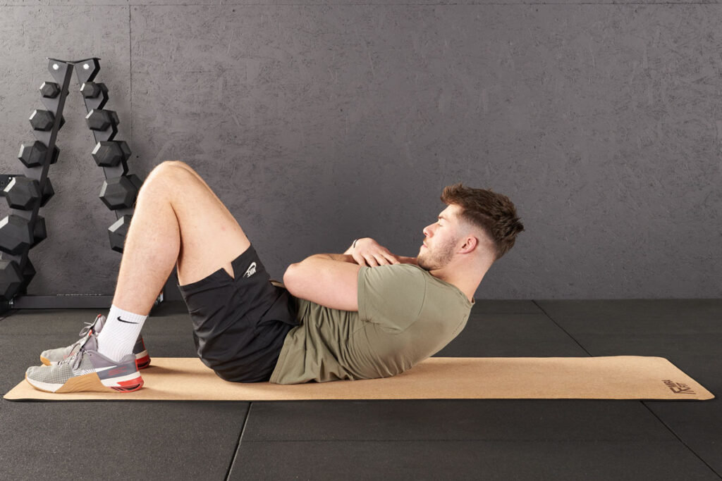 Oblique crunch on a MIrafit Exercise Mat