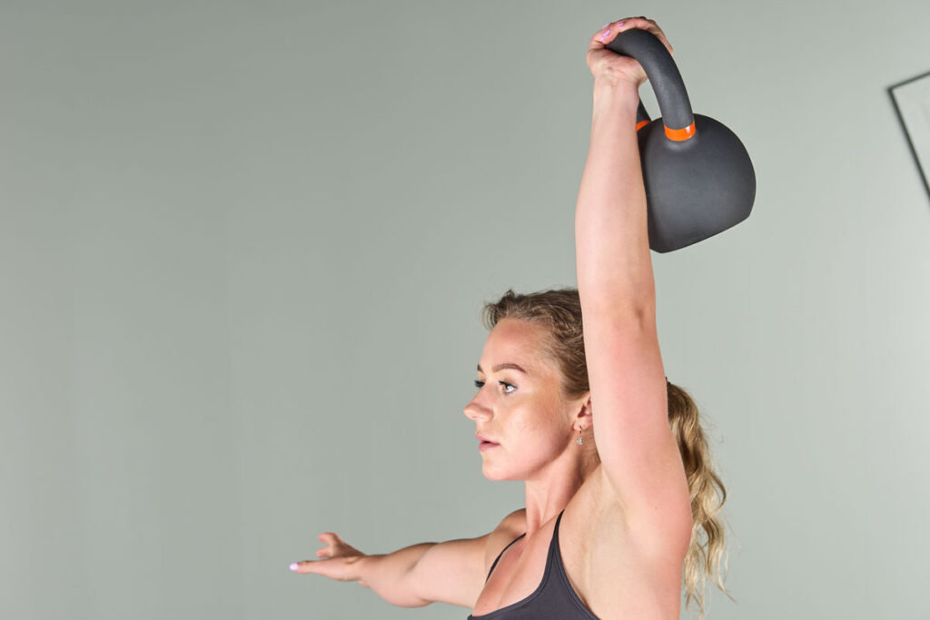 overhead hold with a Mirafit Cast Iron Kettlebell