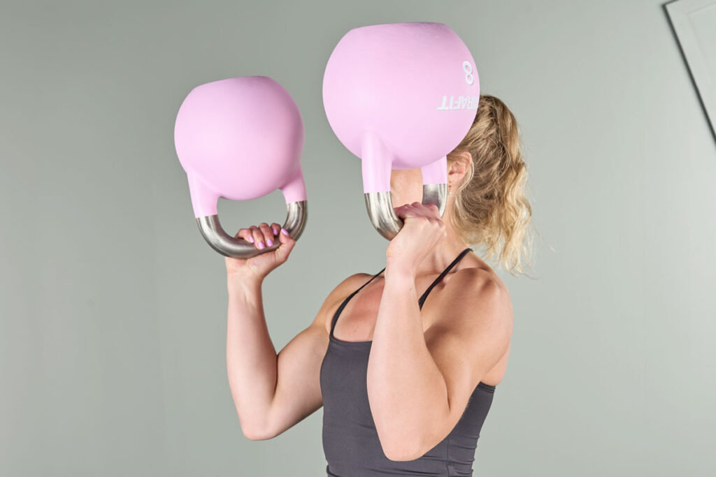 Double bottoms up kettlebell carry with Mirafit Colour Competition Kettlebells
