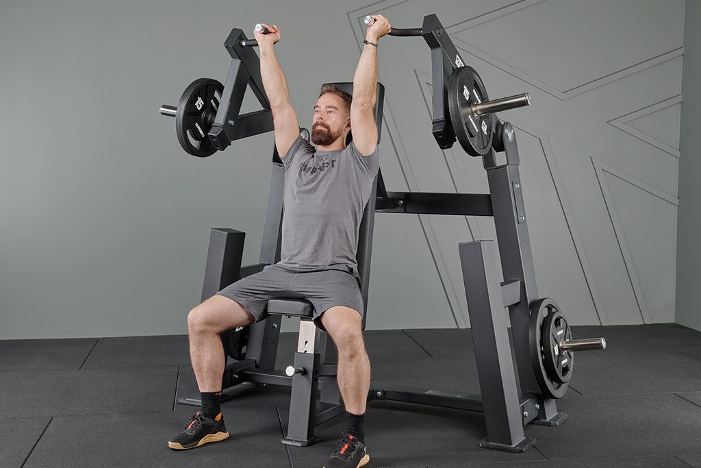 Man using a Mirafit M4 Plate Loaded Shoulder Press Machine