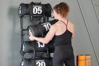 removing a sandbag from Mirafit Premium Exercise Sandbag Storage