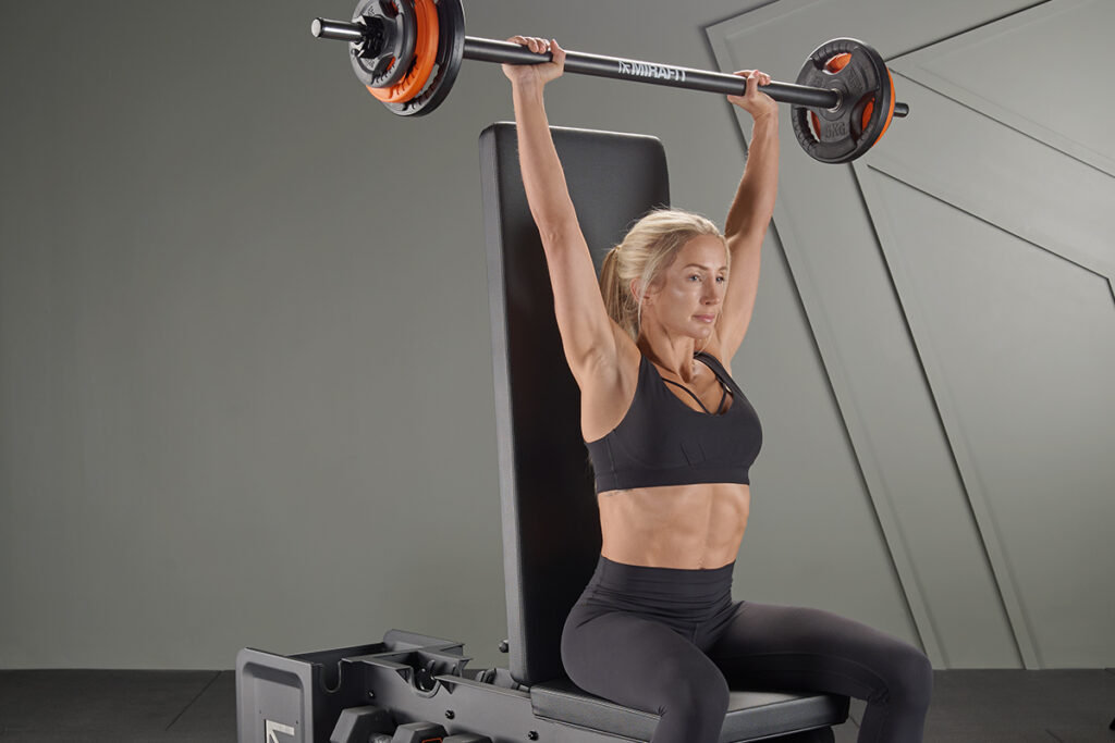 Seated overhead press with a Mirafit 30mm Studio Bar