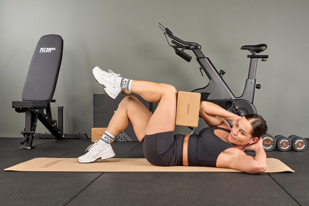 stretching with a Mirafit Cork Yoga Block