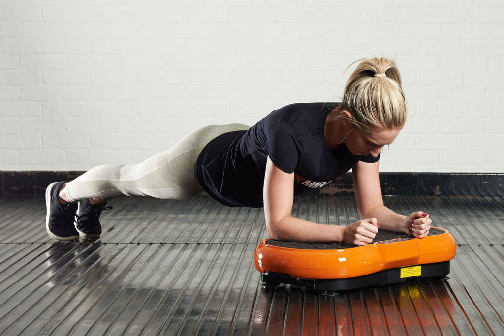 Mirafit Slimline Vibration Plate woman doing a plank on a Mirafit Slimline Vibration Plate