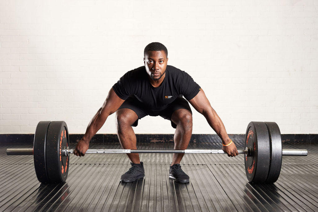 Snatch grip deadlift Man doing a snatch grip deadlift with a Mirafit M3 7ft 20kg Olympic Barbell