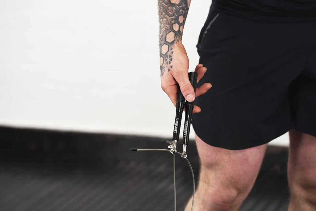 Mirafit 3m Adjustable Ball Bearing Speed Rope Man holding a Mirafit 3m Adjustable Ball Bearing Speed Rope