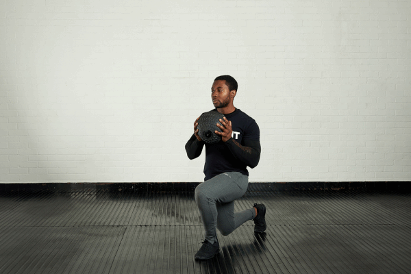 Lunge and twist Man demonstrating the lunge and twist exercise with a Mirafit Tyre Tread Slam Ball