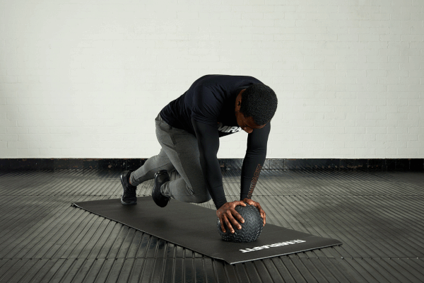 Mountain climbers Man demonstrating the mountain climbers exercise with a Mirafit tyre tread slam ball