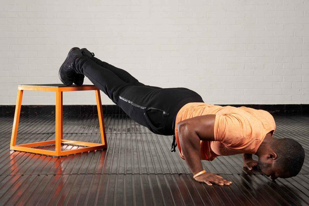 Decline push up Man doing a decline push up with a Mirafit Steel Plyo Jump Box