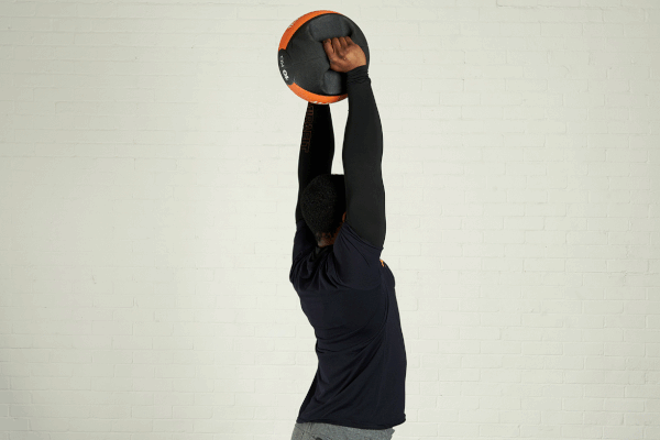 Triceps extension Man demonstrating the triceps extension exercise with a Mirafit double handle medicine ball