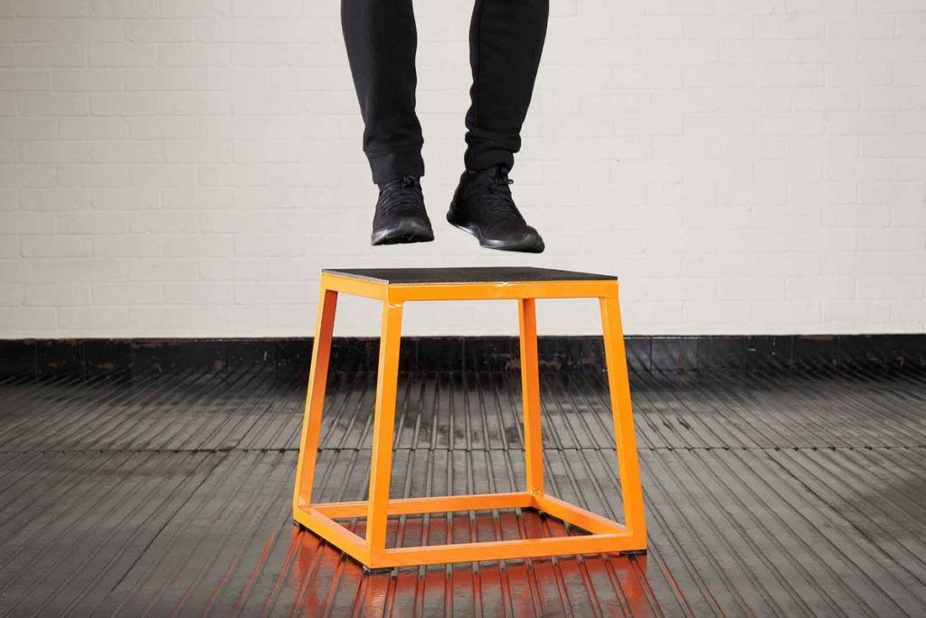 Plyo box jump Man doing a Jump on a Mirafit Steel Plyo Jump Box
